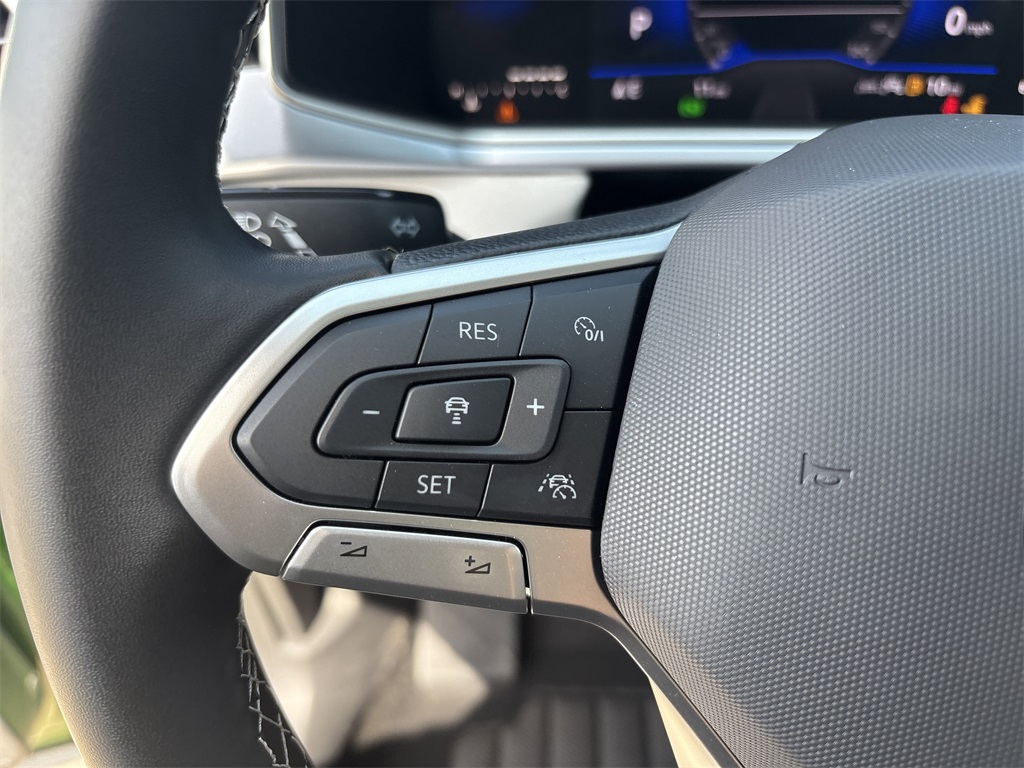 2025 Volkswagen Taos 1.5T SE Green at DeMontrond Auto Country