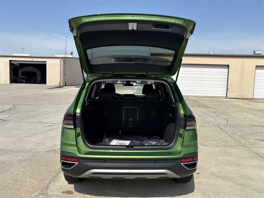 2025 Volkswagen Taos 1.5T SE Green at DeMontrond Auto Country