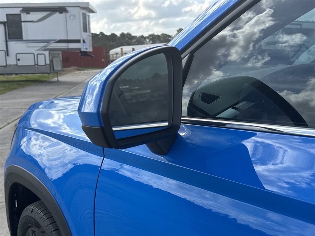 2025 Volkswagen Taos 1.5T SE Blue at DeMontrond Auto Country