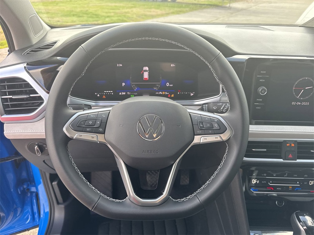 2025 Volkswagen Taos 1.5T SE Blue at DeMontrond Auto Country